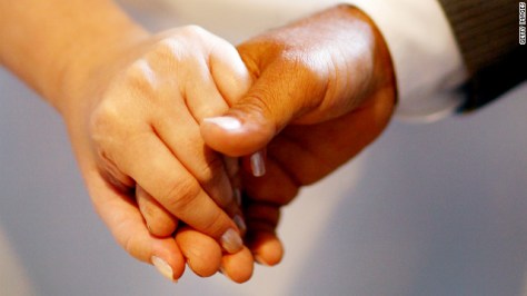 120217015456-interracial-hands-story-top